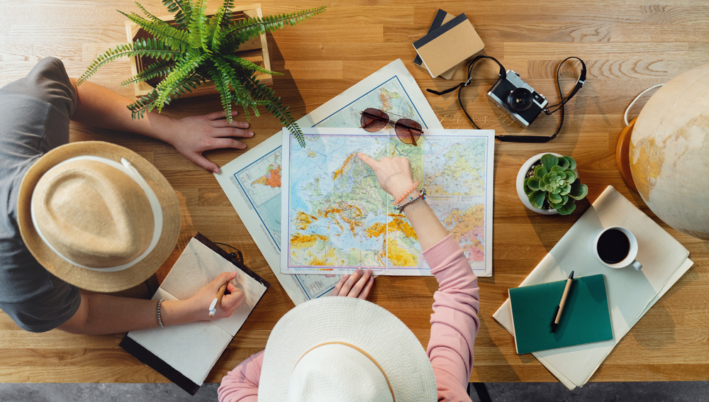 Top view of young couple with map