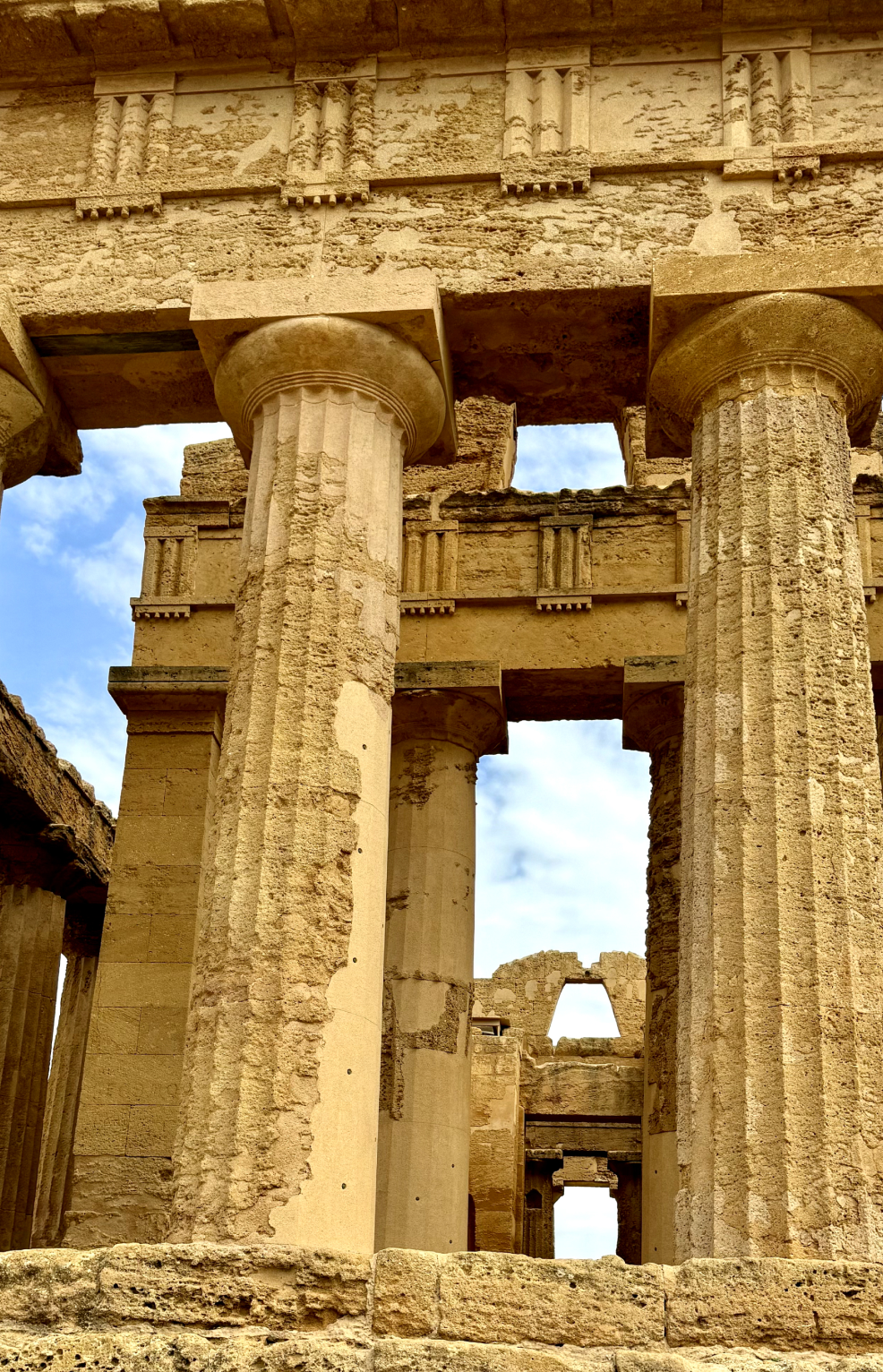 photo of a greek temple in Sicily with sandstone columns 