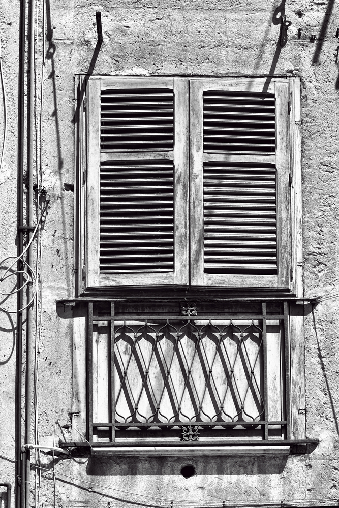 Black and White photo of a window and balcony in Sicly 