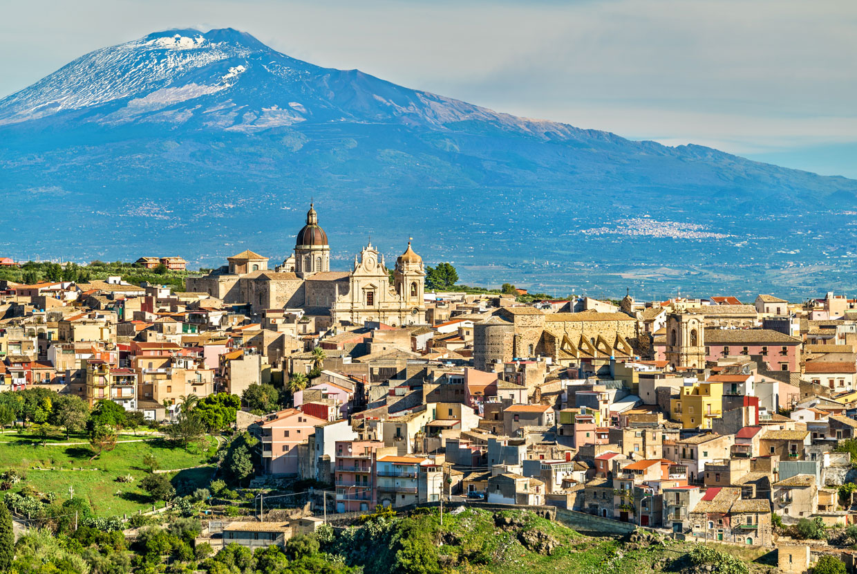 Mount Etna looms high over the city of Catania