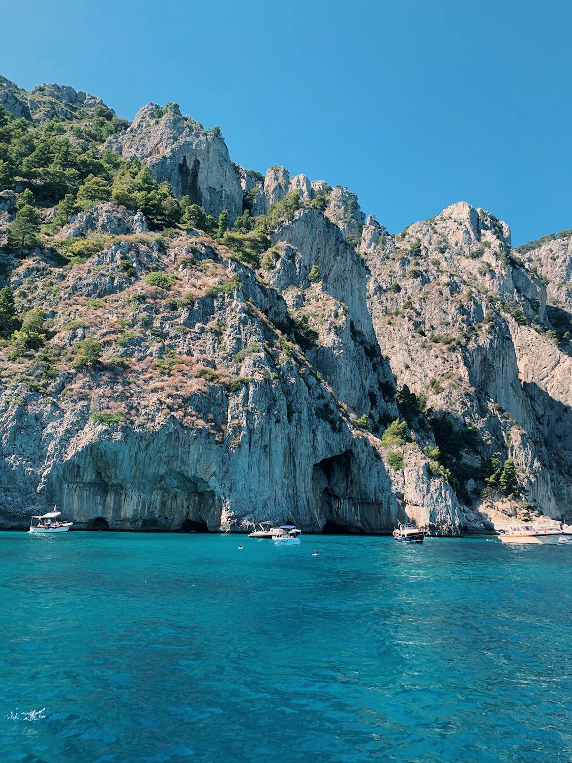 Scenic Photo of Rock Formations by the Sea in Capri
