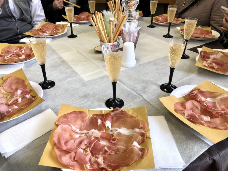 table set with a ham and wine tasting