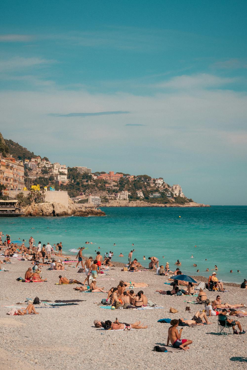 Crowded beach on a sunny day in Nice, France