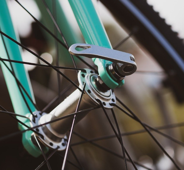 A photo of bicycle forks and wheel