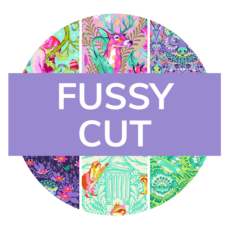 A photo of fabric with the text “Fussy Cut“