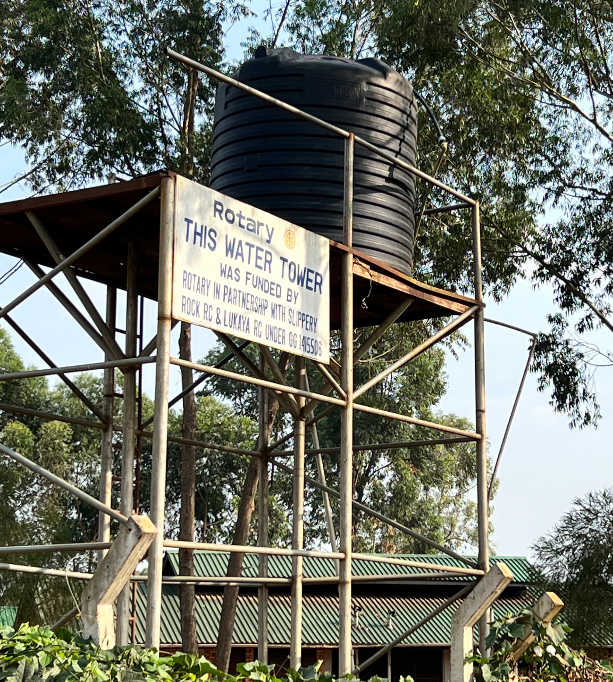 A 20,000 liter water tank on a high tower that looks damaged