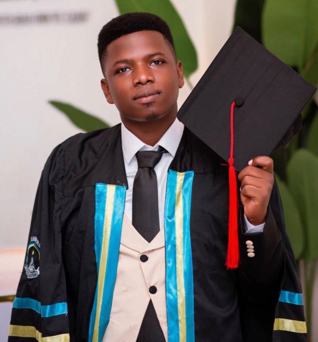 Young Ugandan man in graduation gown