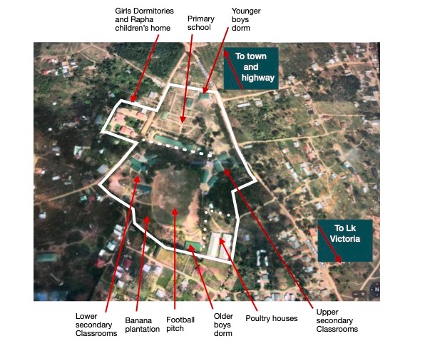 Aerial view of school campus showing semi-rural area and many buildings