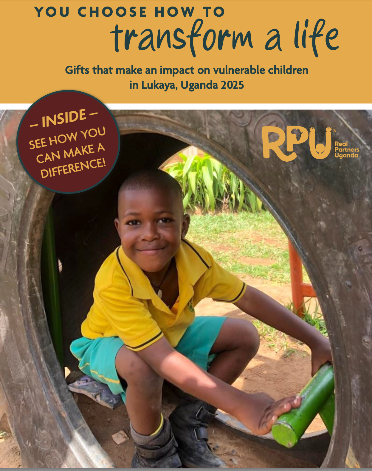Young boy smiling while pretending  to drive a truck on a playground