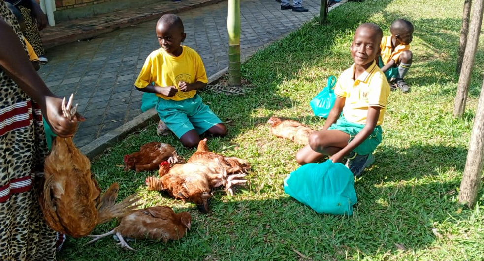 Children with Christmas packages and chickens
