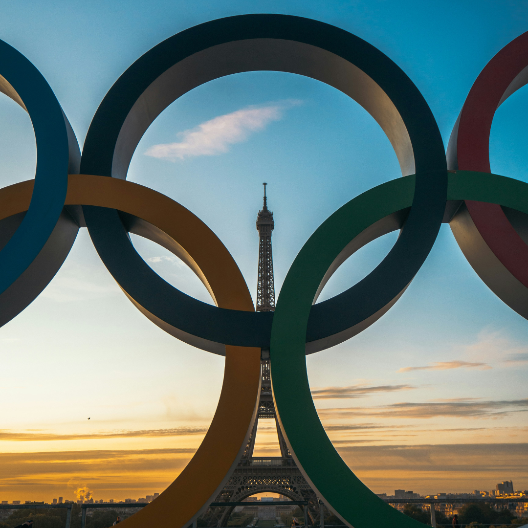 Olympic rings with the sight of the Eiffel Tower at the back