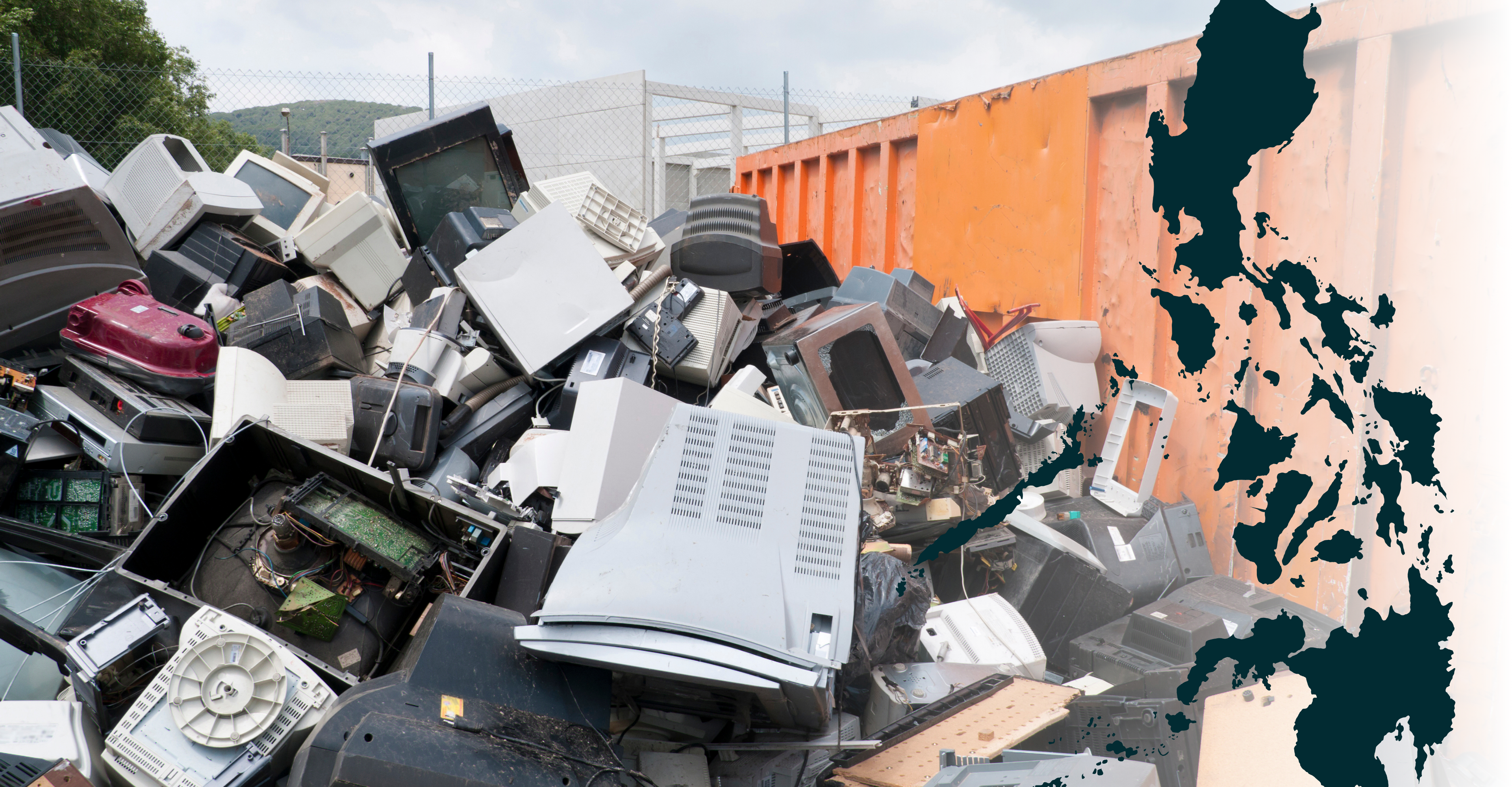 A large landfill site with waste piled high, surrounded by garbage trucks and excavators. 