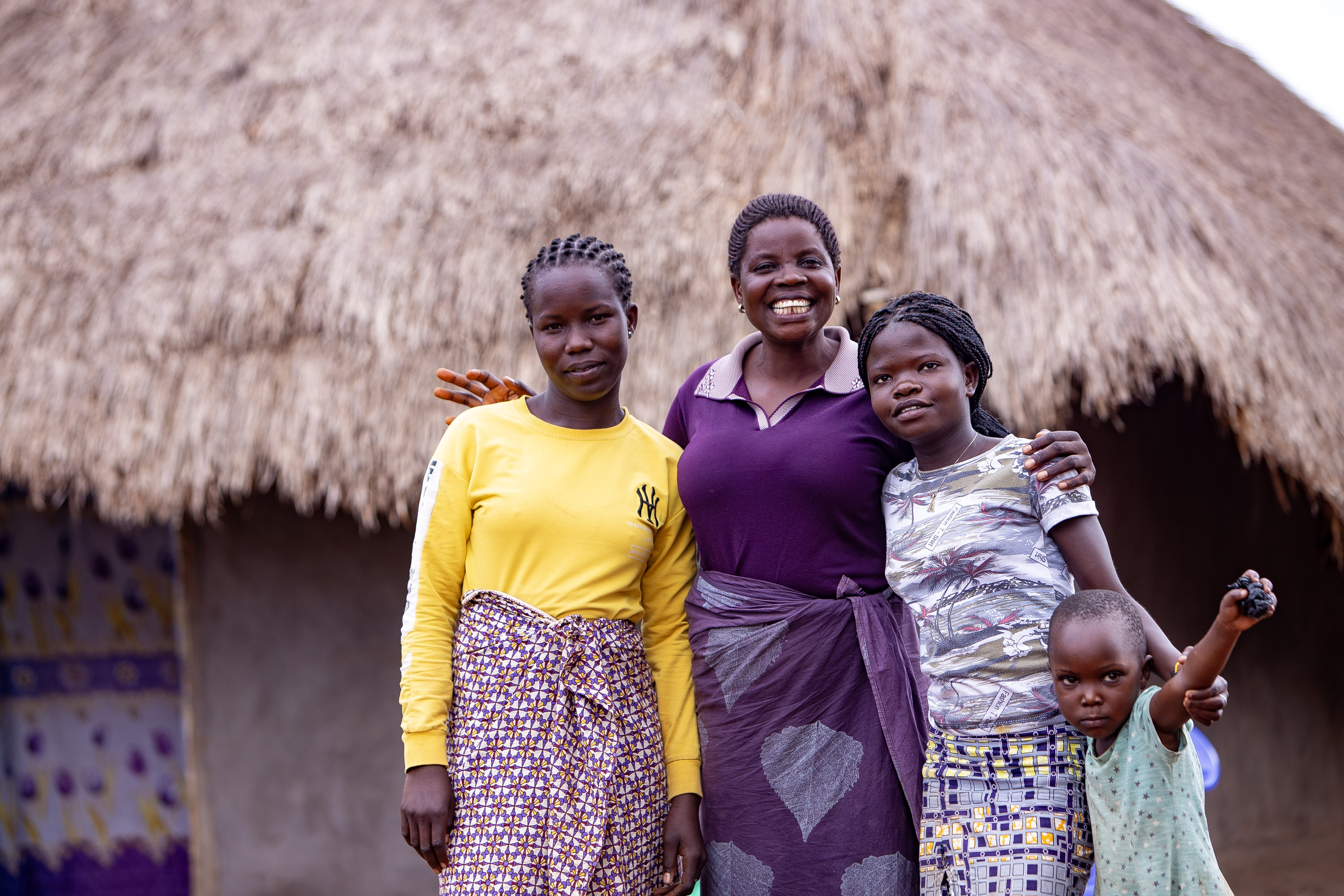 A Savings Group participant and her children in DRC