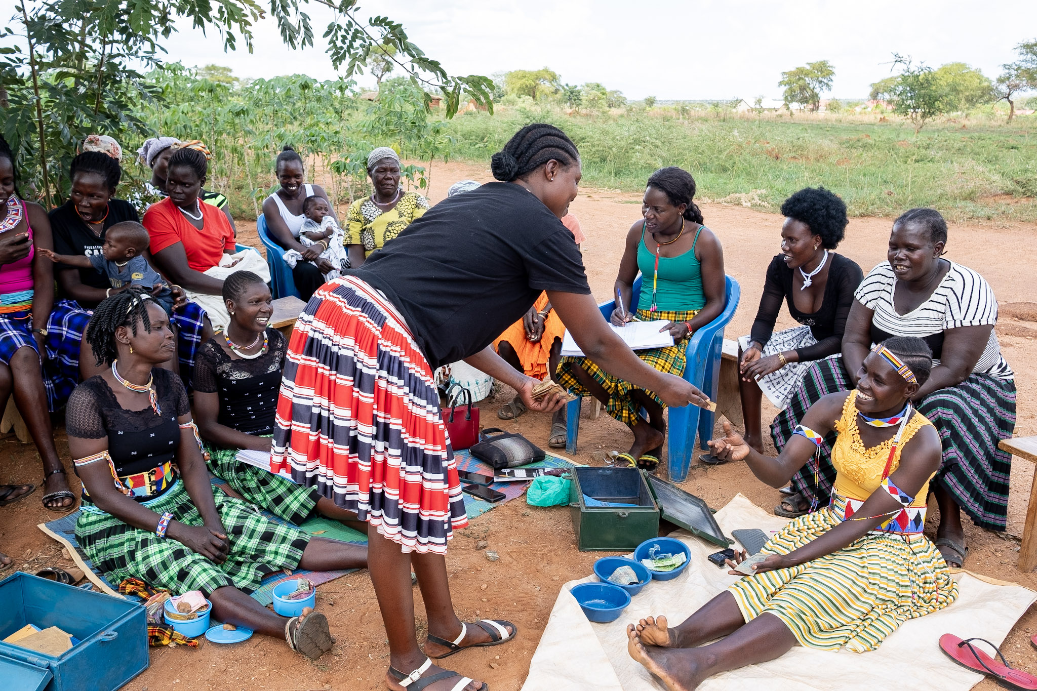 Savings Group participants distributing savings