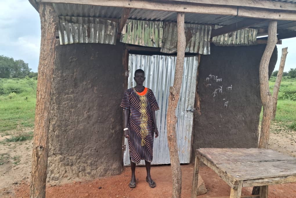 Mercy, a program participant in South Sudan, at her shop
