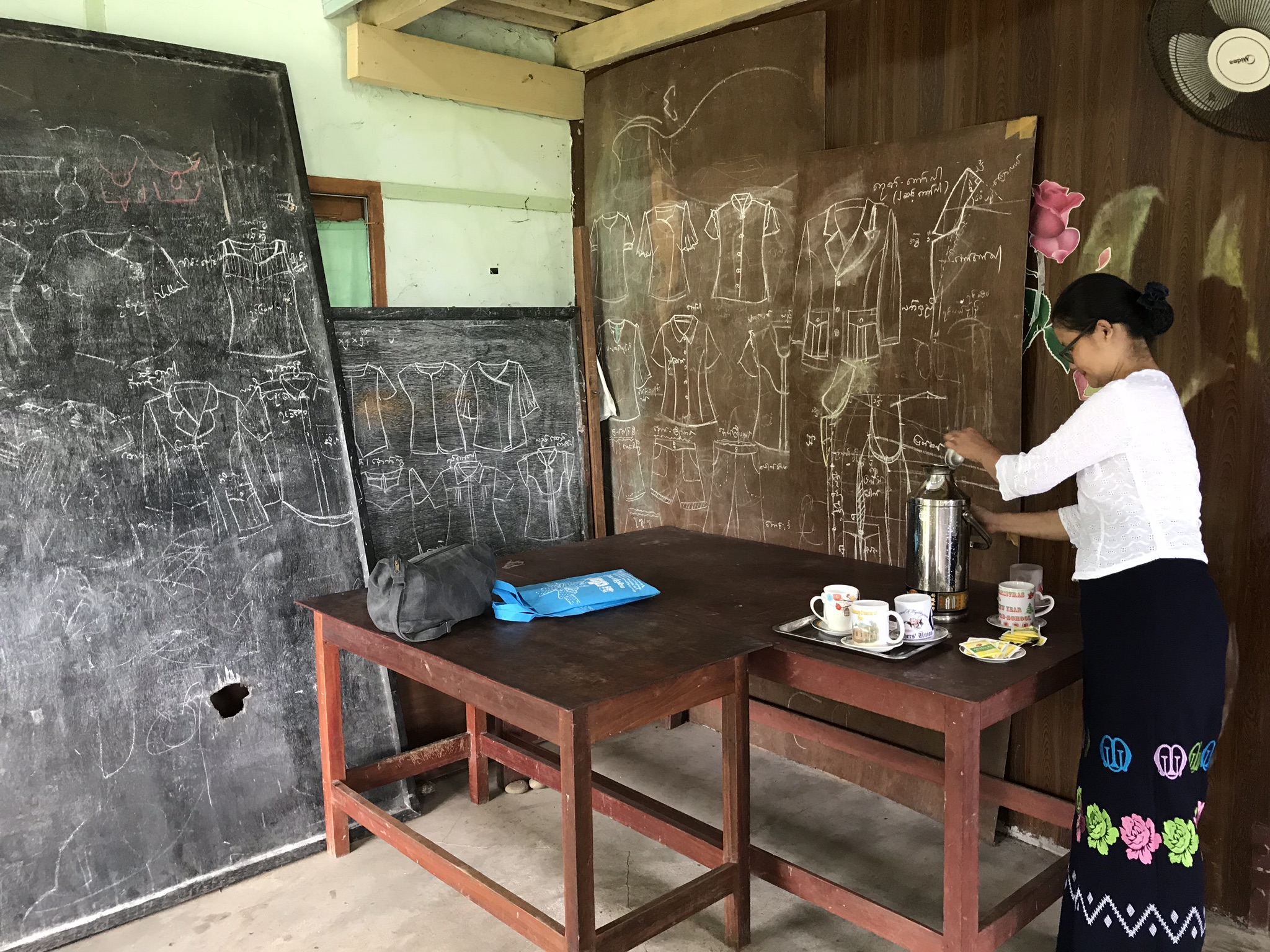 Savings Group member in Myanmar preparing tea