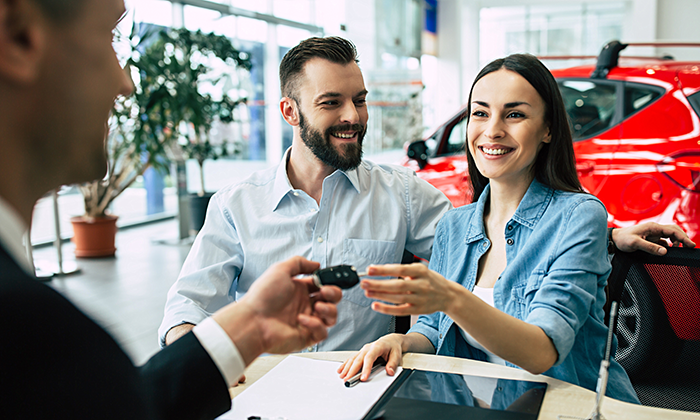 Couple buying a car