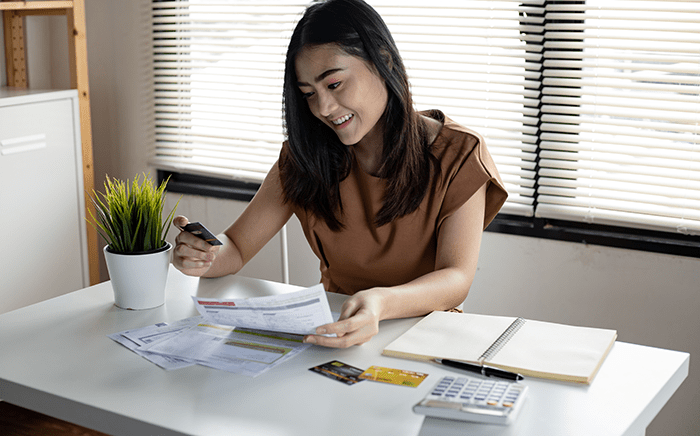 Woman looking at credit card statements